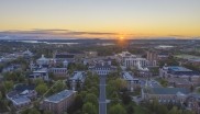 An aerial image of the StFX campus and the surrounding area at sunset. 