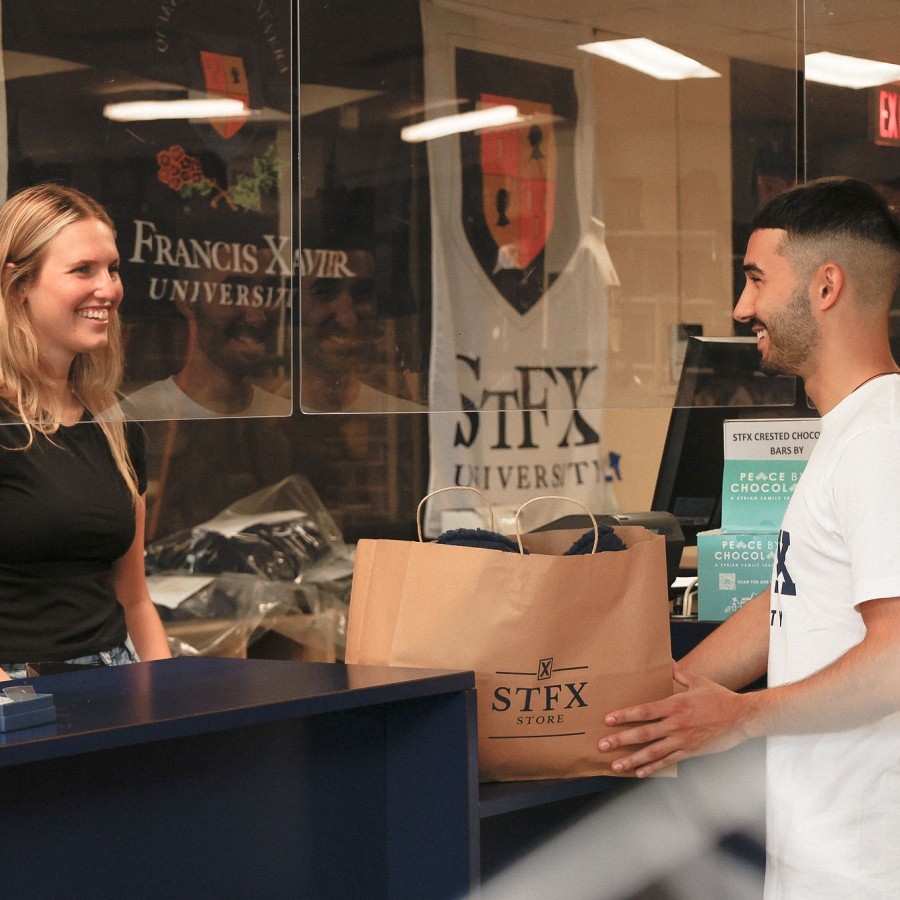 A student making a purchase at the StFX Store