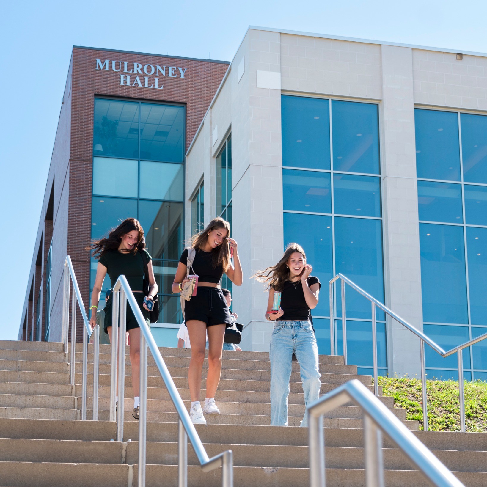 Students walking down the steps outside Mulroney Hall