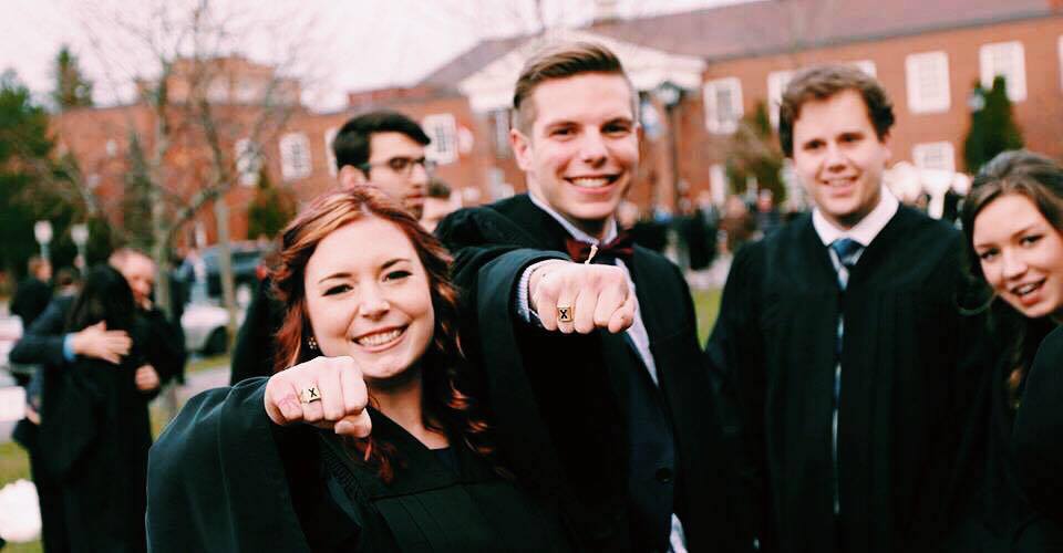 StFX Graduation and Alumni holding up their X-Rings