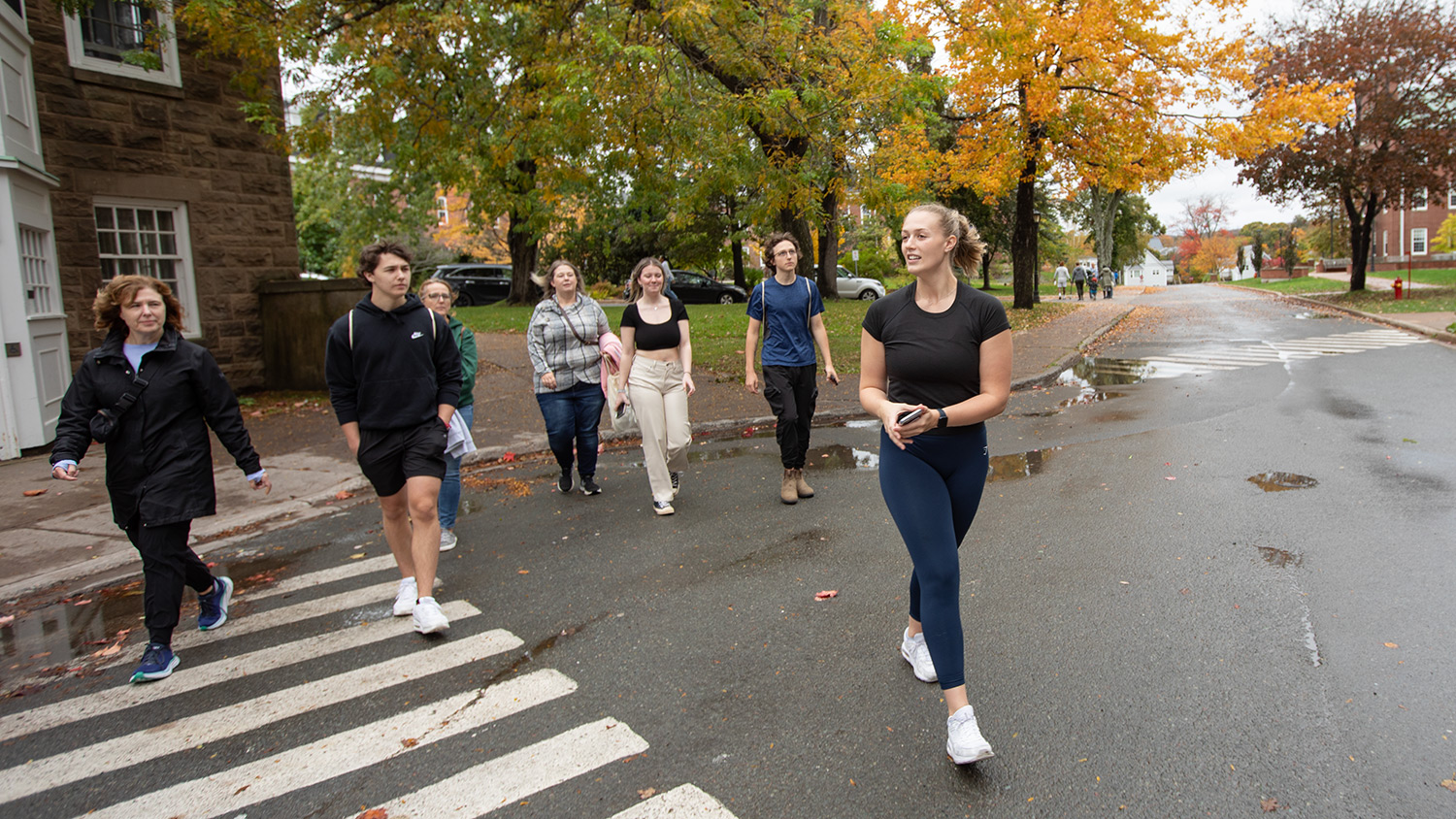 Student giving campus tour to prospective students
