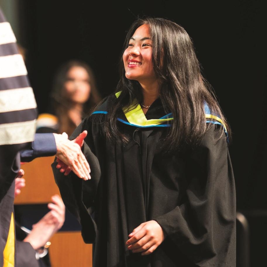 Student at Convocation receiving a degree