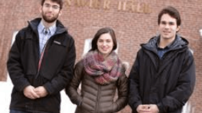 Three people standing together 