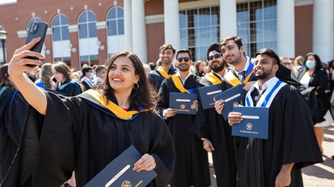 Students outside the Keating Centre after Convocation