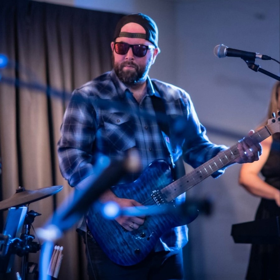 Brent Collins playing electric guitar