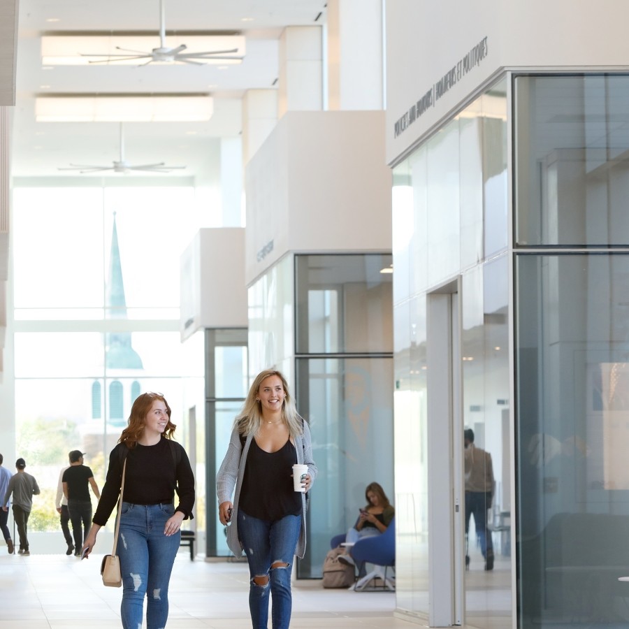 Students walking on the second floor of Mulroney Hall