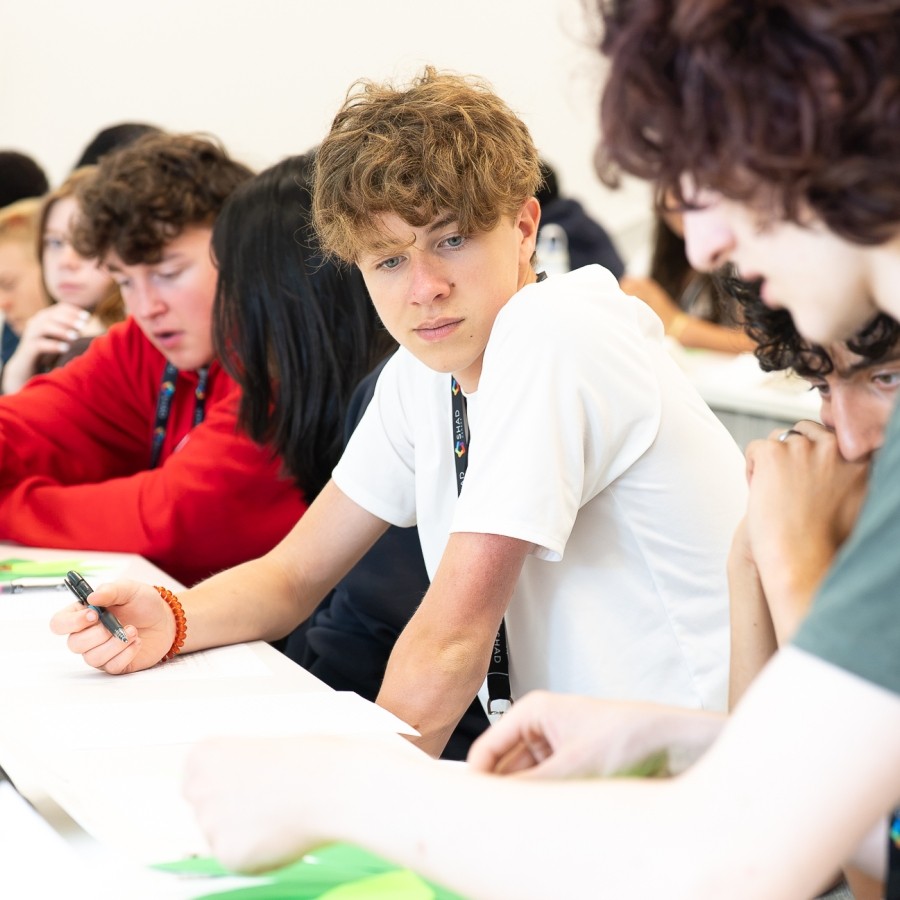 Students work together at a table during SHAD