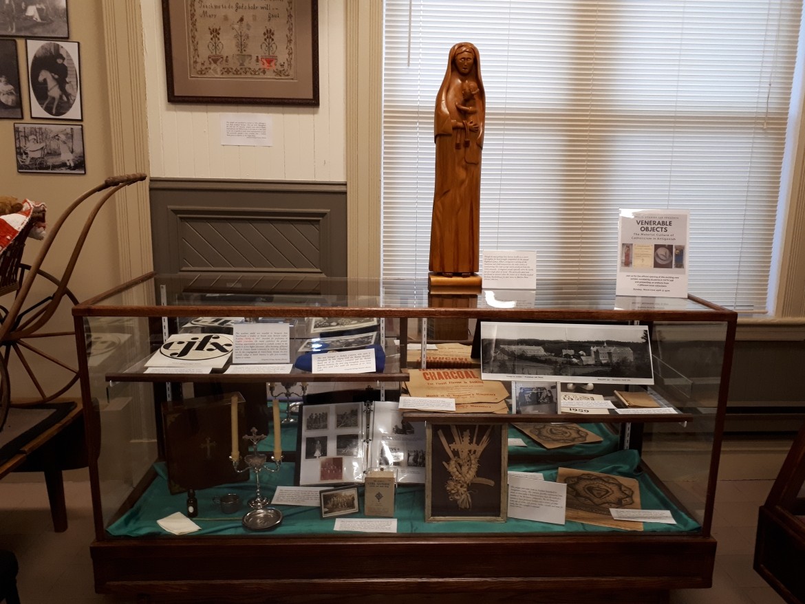 In the picture there is a counter with several historic and religious artifacts