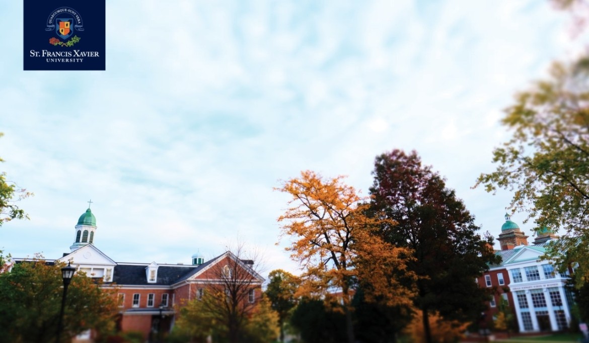 A campus with a clock tower in the background