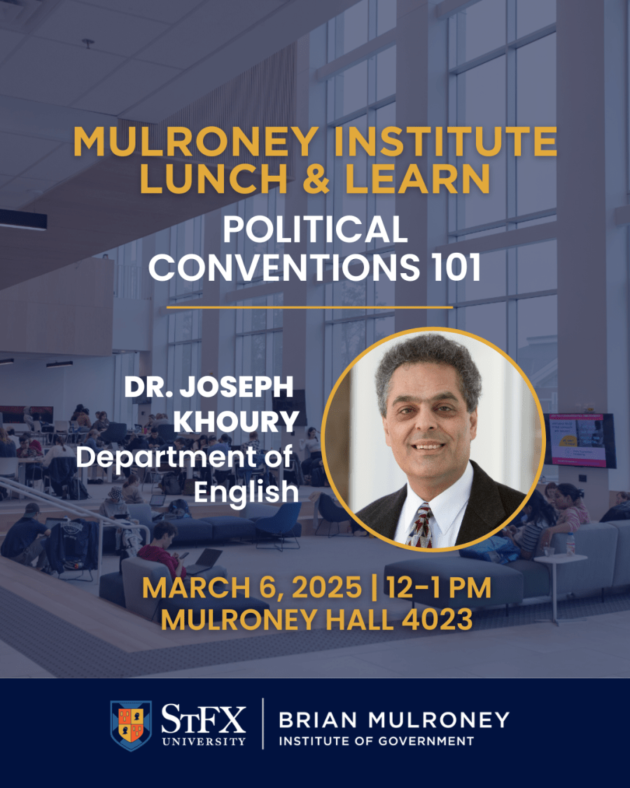 Large room with floor-to-ceiling windows and students studying in chairs.
