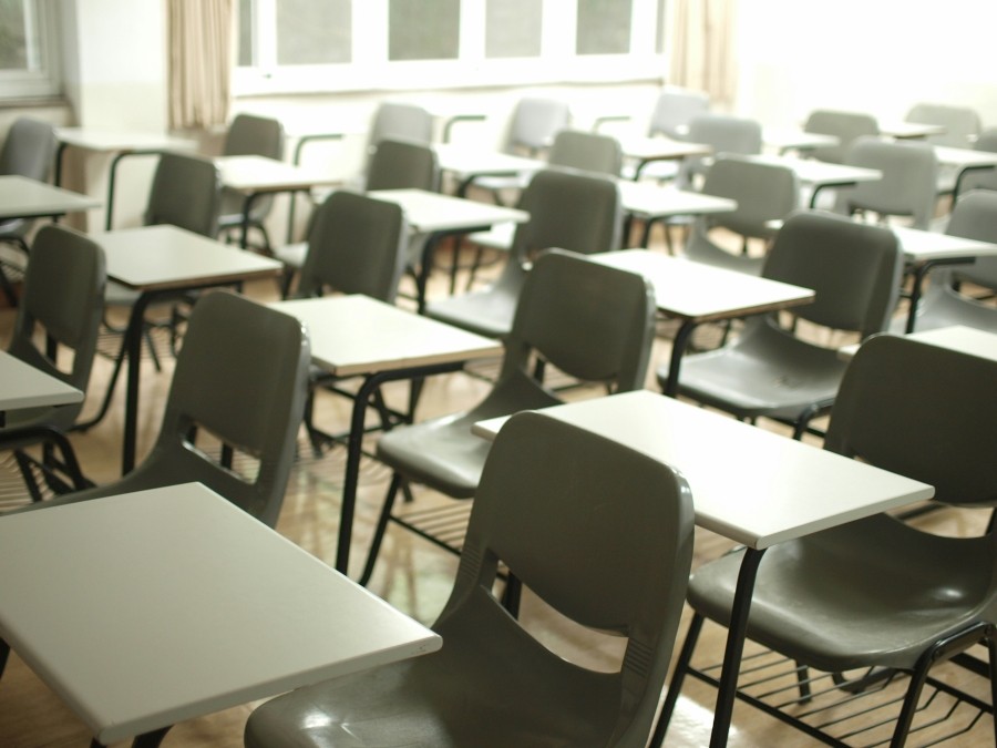 Classroom of tables and desks set up in rows.