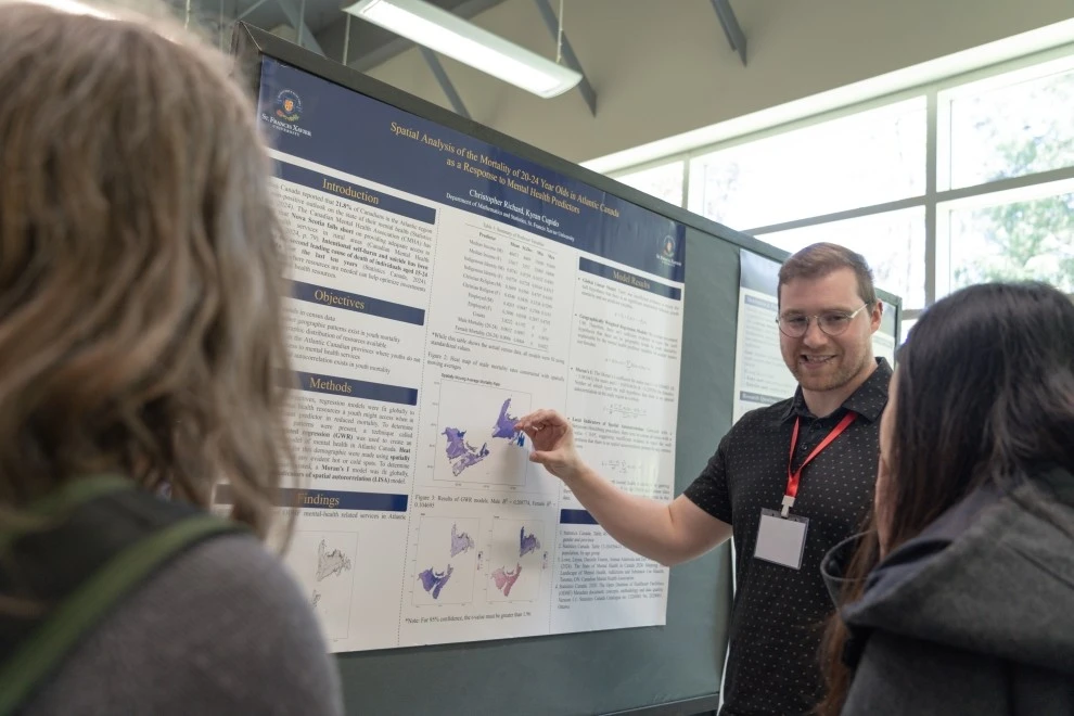 StFX student Christopher Richard presenting mathematics and youth mental health research findings
