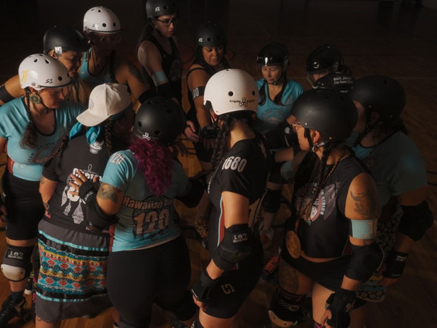Image of roller derby athletes in a circle