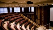 Inside view of the Schwartz Auditorium with rows of seating and a centre stage