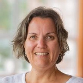 Headshot of woman smiling.